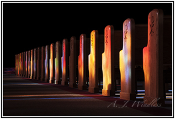 This is a photo of the church pews uniquely lit by the stained glass windows at my mother's funeral. This thumbnail leds to my original true stories and to the story behind this photo.